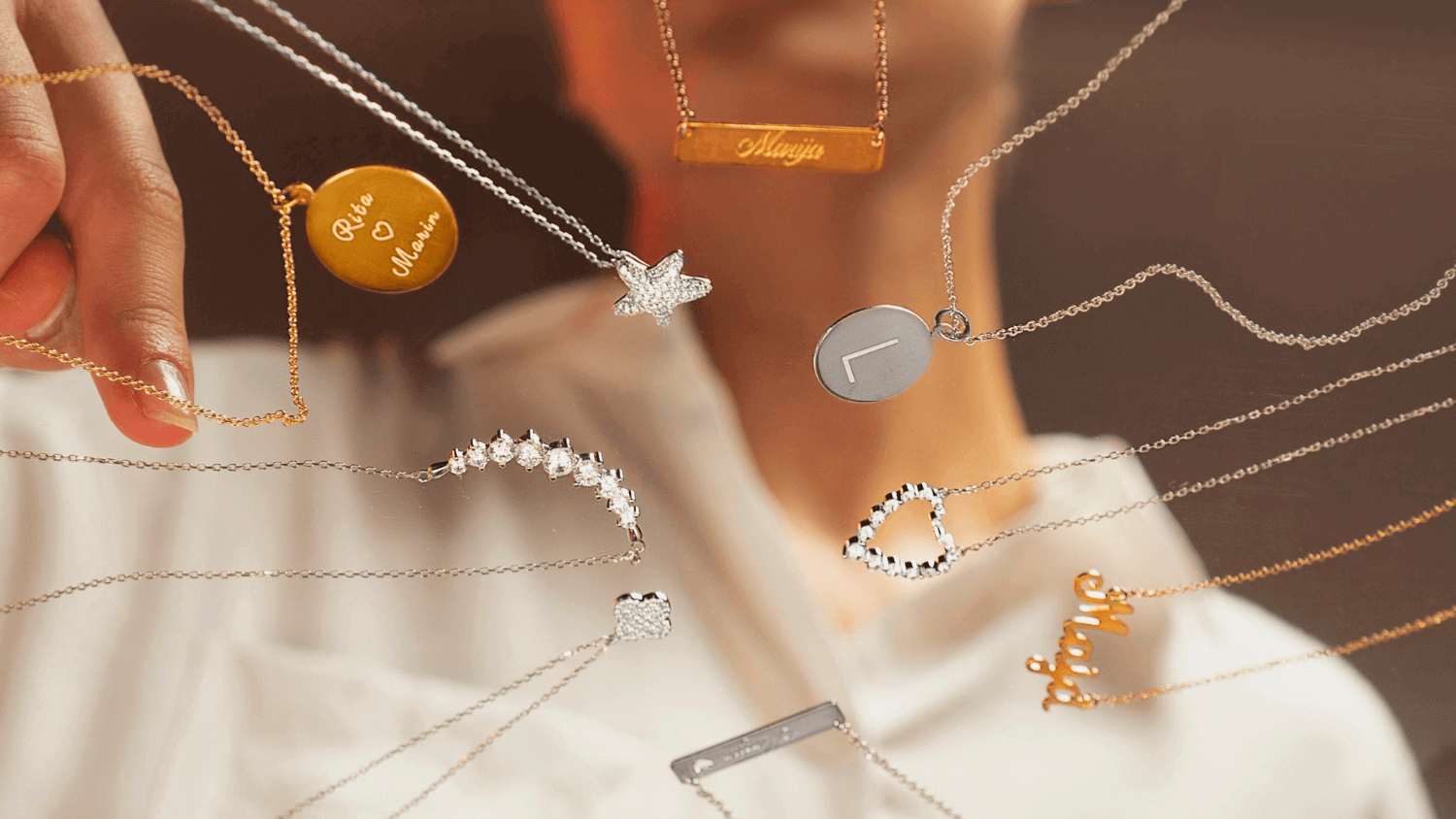 young woman looking charm silver jewelry in different colors and shapes